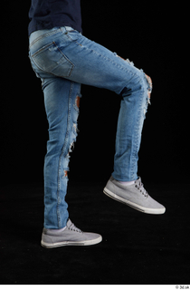 Claudio  1 blue jeans clothing flexing grey sneakers leg…